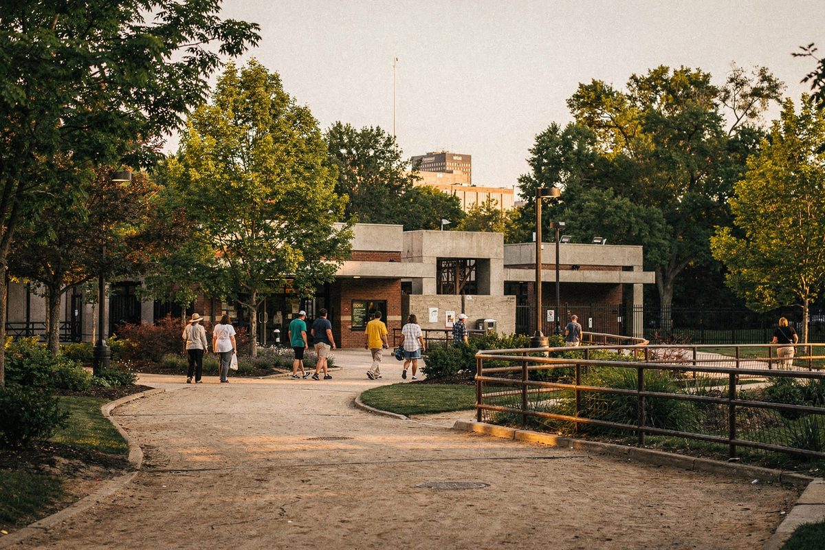 Visitors approaching a planted zoo entrance